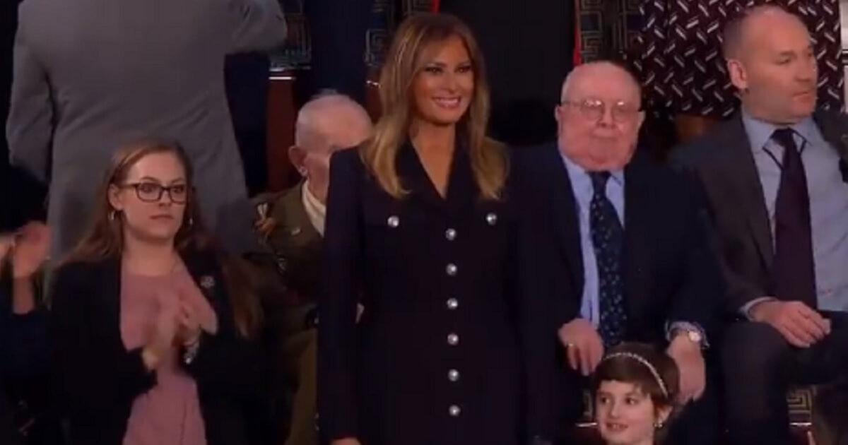 Melania Trump smiles at the State of the Union audience.