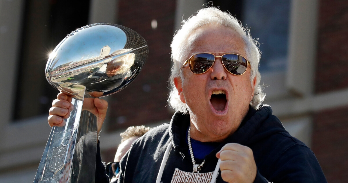 New England Patriots owner Robert Kraft yells to fans during their victory parade through downtown Boston.