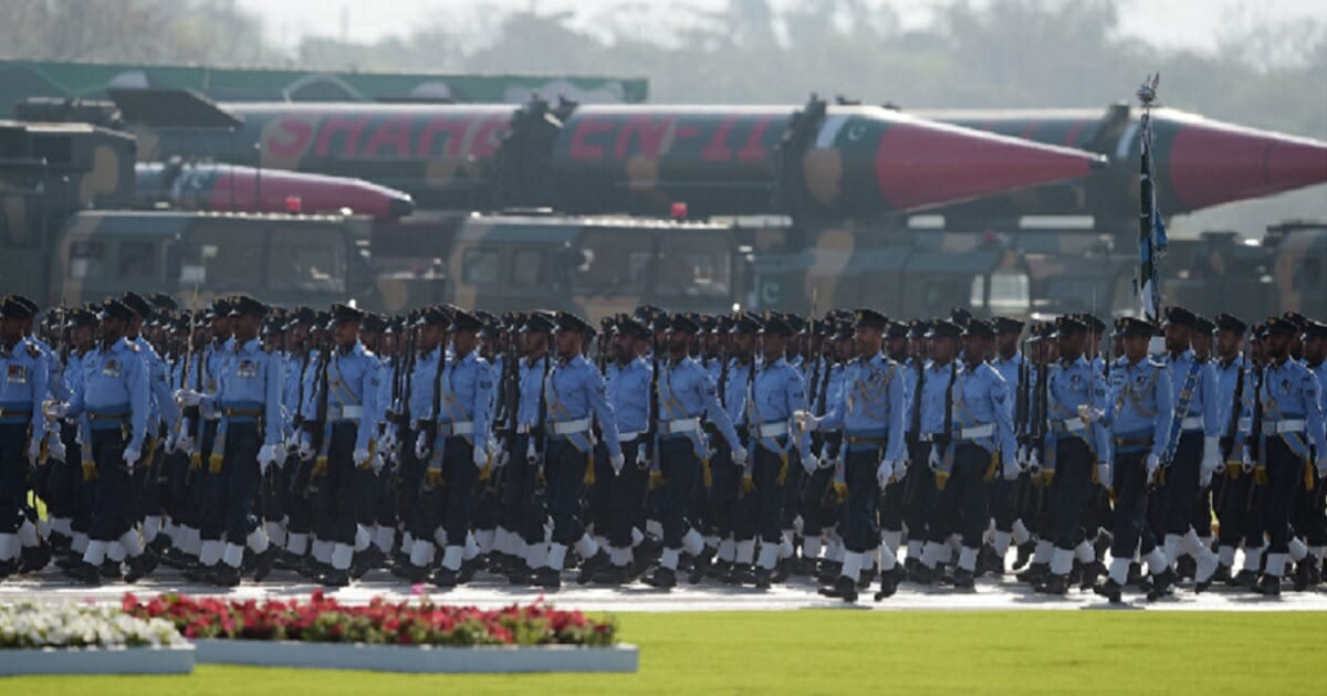 Pakistani soldiers march by an array of missiles during the March 23, 2018, Pakistan National Day military parade.