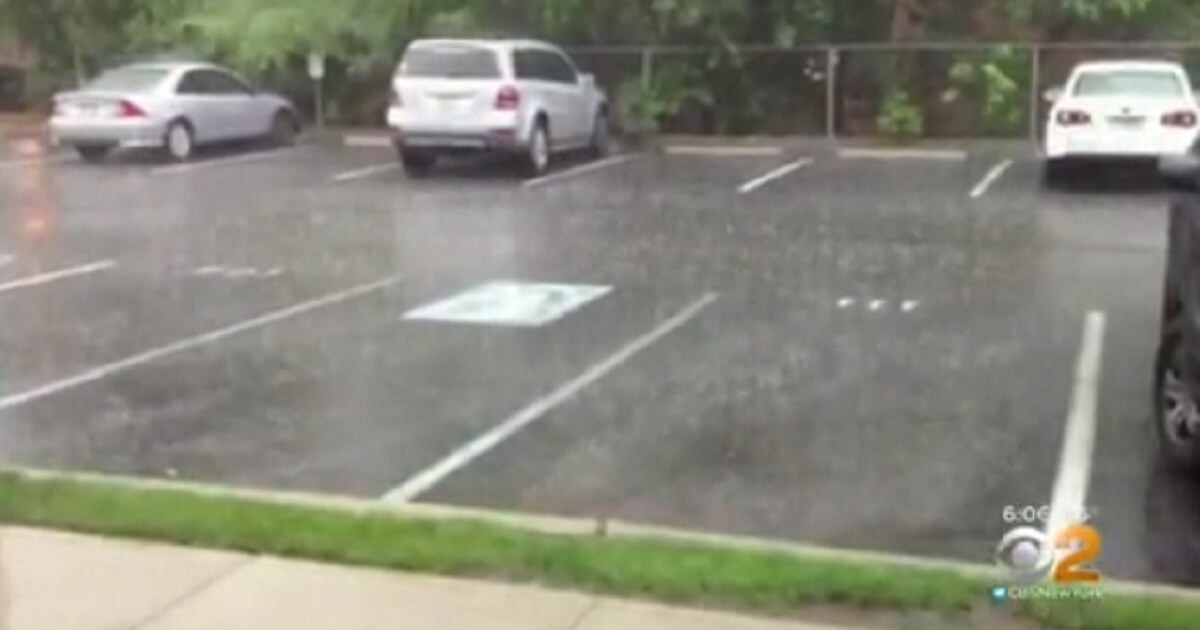 A parking lot on a a rainy day.