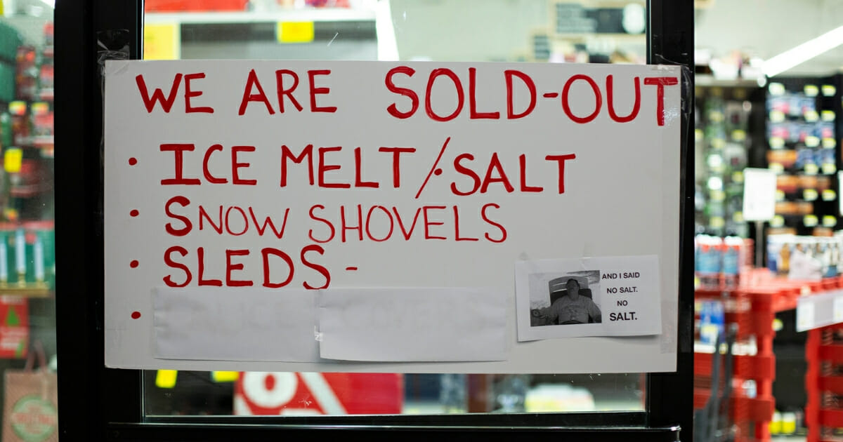A sign at a hardware store warns customers that there is no remaining ice melt, salt, snow shovels, or sleds for sale on February 8, 2019 in Seattle, Washington.