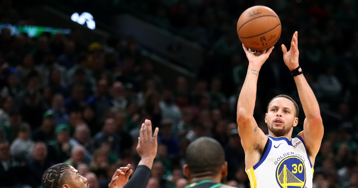 Stephen Curry of the Golden State Warriors takes a shot against the Boston Celtics at TD Garden on Jan. 26.