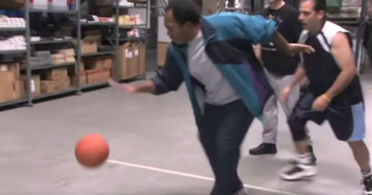 Michael Scott watches Stanley Hudson dribble in the "Basketball" episode of NBC's "The Office."
