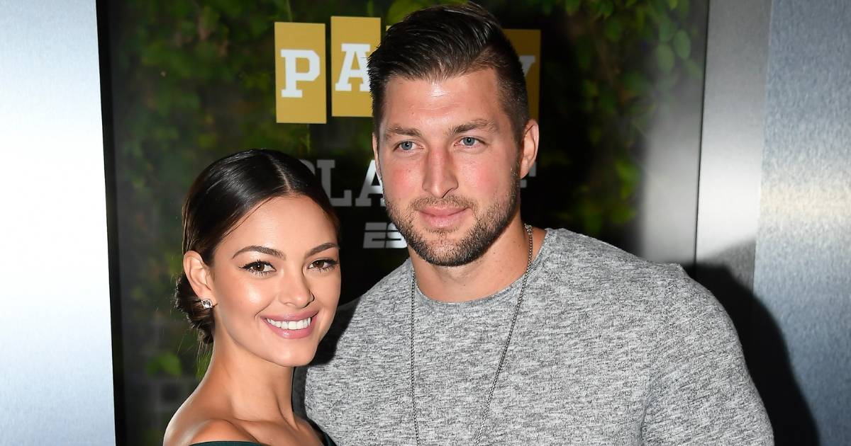 Miss Universe 2017 Demi-Leigh Nel-Peters and Tim Tebow of ESPN attend the Party At The Playoff at The GlassHouse on Jan. 5, 2019, in San Jose, California.