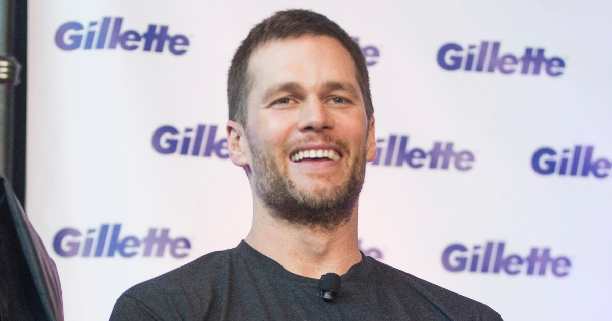 New England Patriots quarterback Tom Brady appears at Gillette's Boston headquarters Thursday for a charity event.
