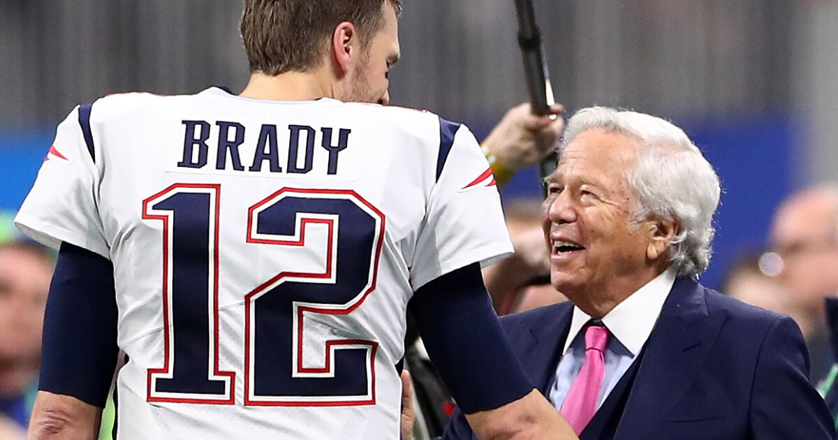 Tom Brady of the New England Patriots speaks with owner Robert Kraft prior to Super Bowl LIII against the Los Angeles Rams at Mercedes-Benz Stadium in Atlanta on Feb. 3.