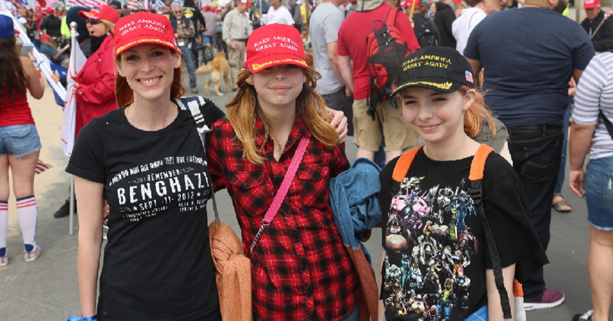 Supporters of President Donald Trump proudly sport "Make America Great Again" caps during a 2017 rally in Huntington Beach, California.