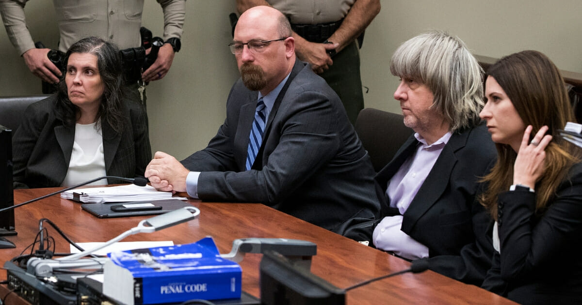 Louise Anna Turpin, left, and David Allen Turpin, second from right, appear in court with attorneys Jeff Moore and Alison Lowe on Jan. 18, 2018, in Riverside, California.