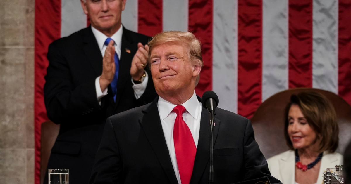 President Donald Trump gives his State of the Union address to a joint session of Congress at the Capitol in Washington, as Vice President Mike Pence and House Speaker Nancy Pelosi look on.