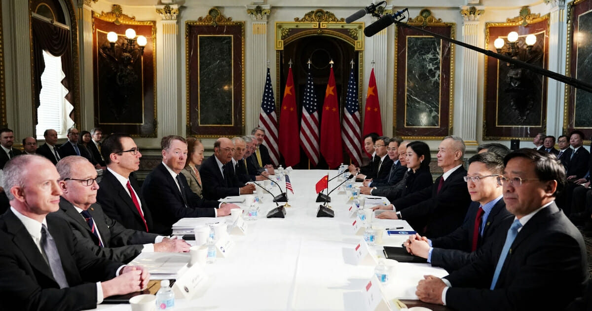 U.S. and Chinese representatives take part in trade talks Thursday in the Eisenhower Executive Office Building, next to the White House.