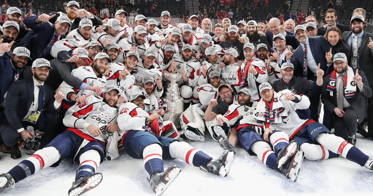 Washington Capitals winger Devante Smith-Pelly, second from left in the front row, and his teammates celebrate their 4-3 victory over the Vegas Golden Knights in Game 5 of the 2018 NHL Stanley Cup Final at the T-Mobile Arena on June 7, 2018.