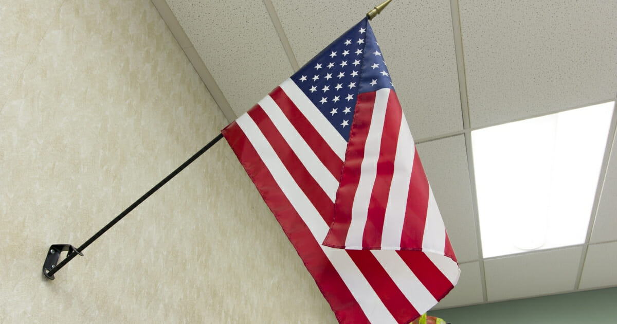 American flag hanging in a classroom.