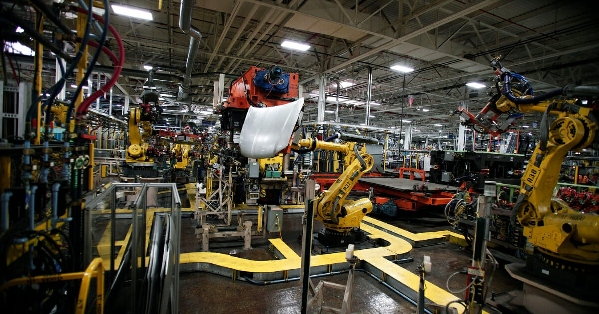 Robots handle parts for Fiat Chrysler Automobiles at the FCA Sterling Stamping Plant Aug. 26, 2016, in Sterling Heights, Michigan.