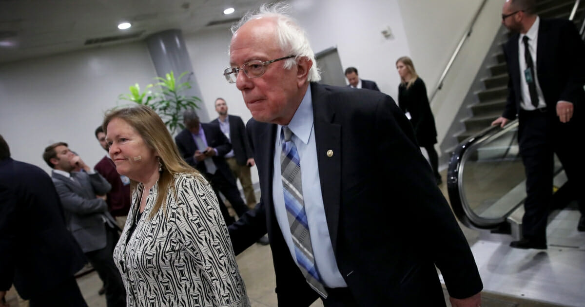 Sen. Bernie Sanders walks with his wife Jane after leaving the Senate floor.