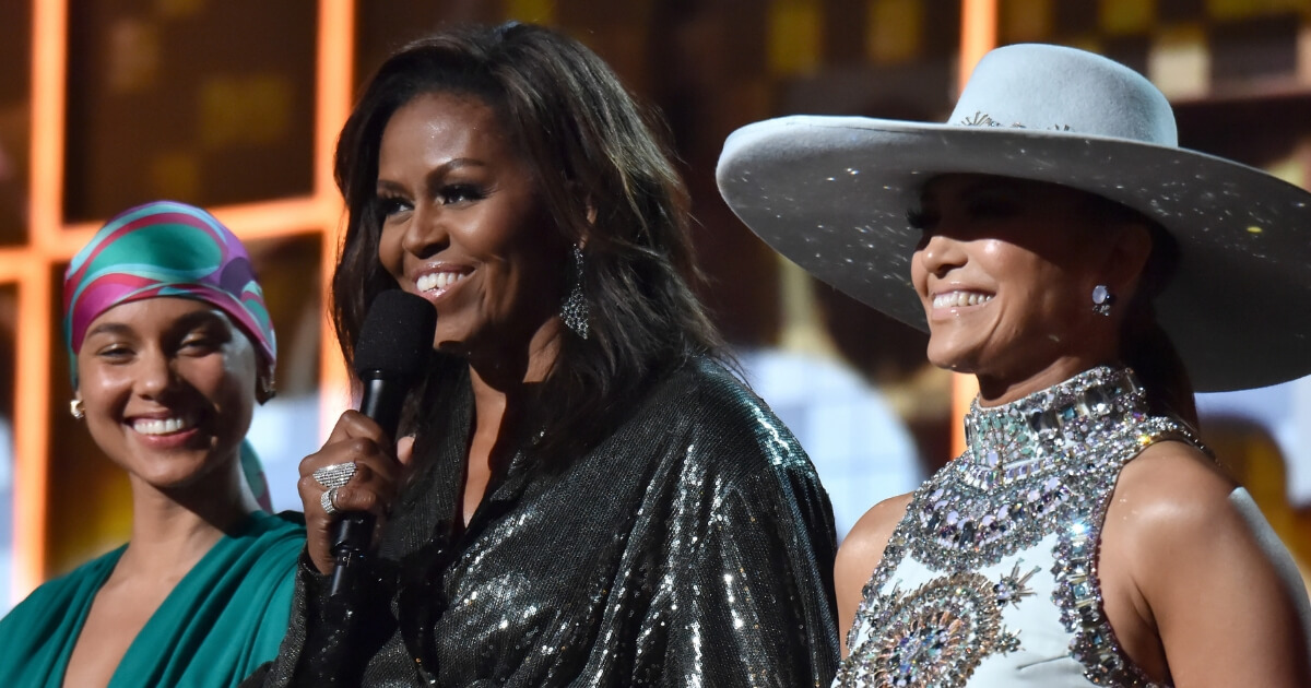 Alicia Keys, Michelle Obama and Jennifer Lopez speak onstage during the 61st Annual GRAMMY Awards.