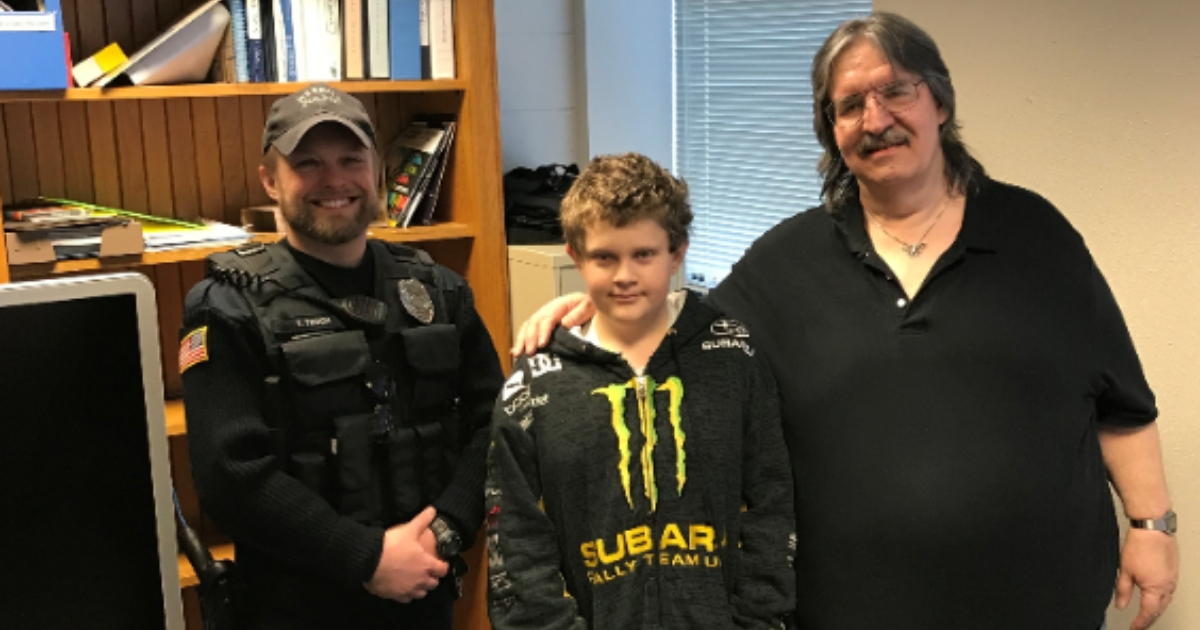 Police officer, left, 13-year-old boy, center, and the man he saved, right.