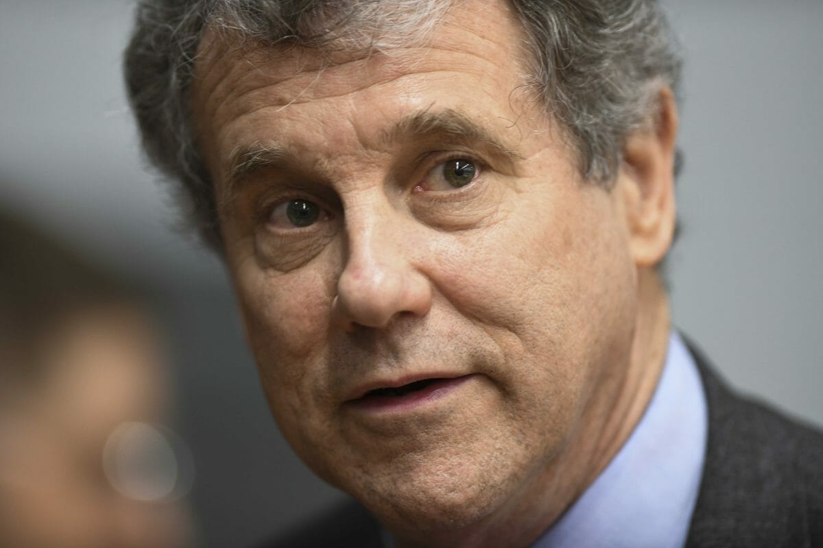 Democratic Sen. Sherrod Brown of Ohio speaks to reporters during the Martin Luther and Coretta Scott King Unity Breakfast Sunday, March 3, 2019, in Selma, Alabama.