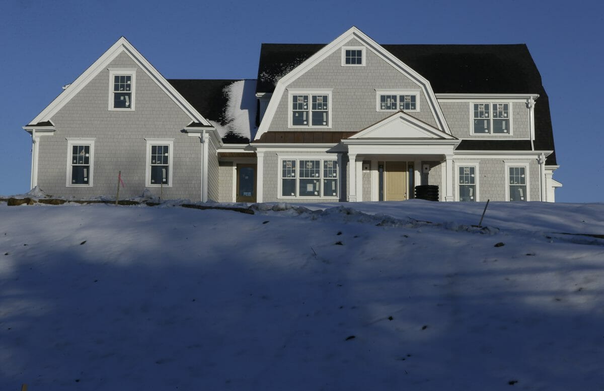 A recently constructed home is surrounded by snow in Natick, Massachusetts.
