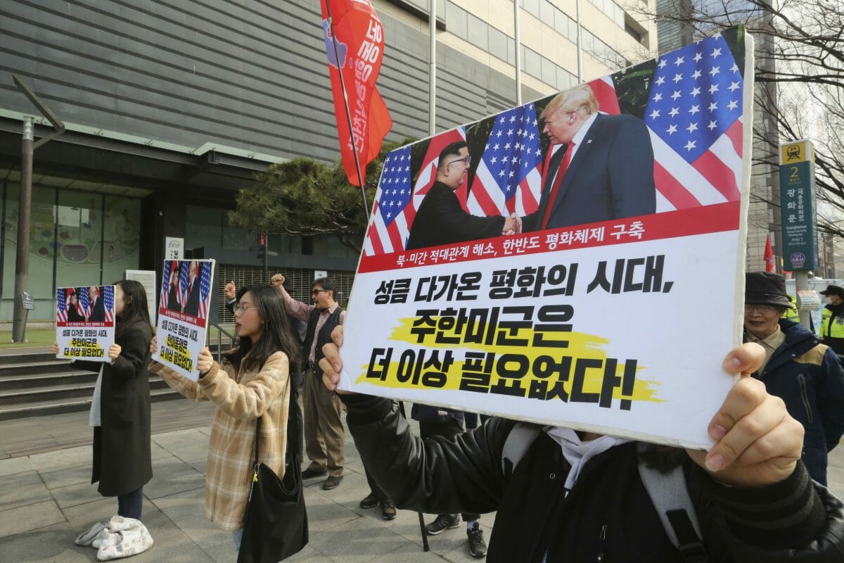 South Korean protesters with banners showing photos of U.S. President Donald Trump and North Korean leader Kim Jong Un stage a rally to denounce policies of the United States on North Korea in Seoul, South Korea.