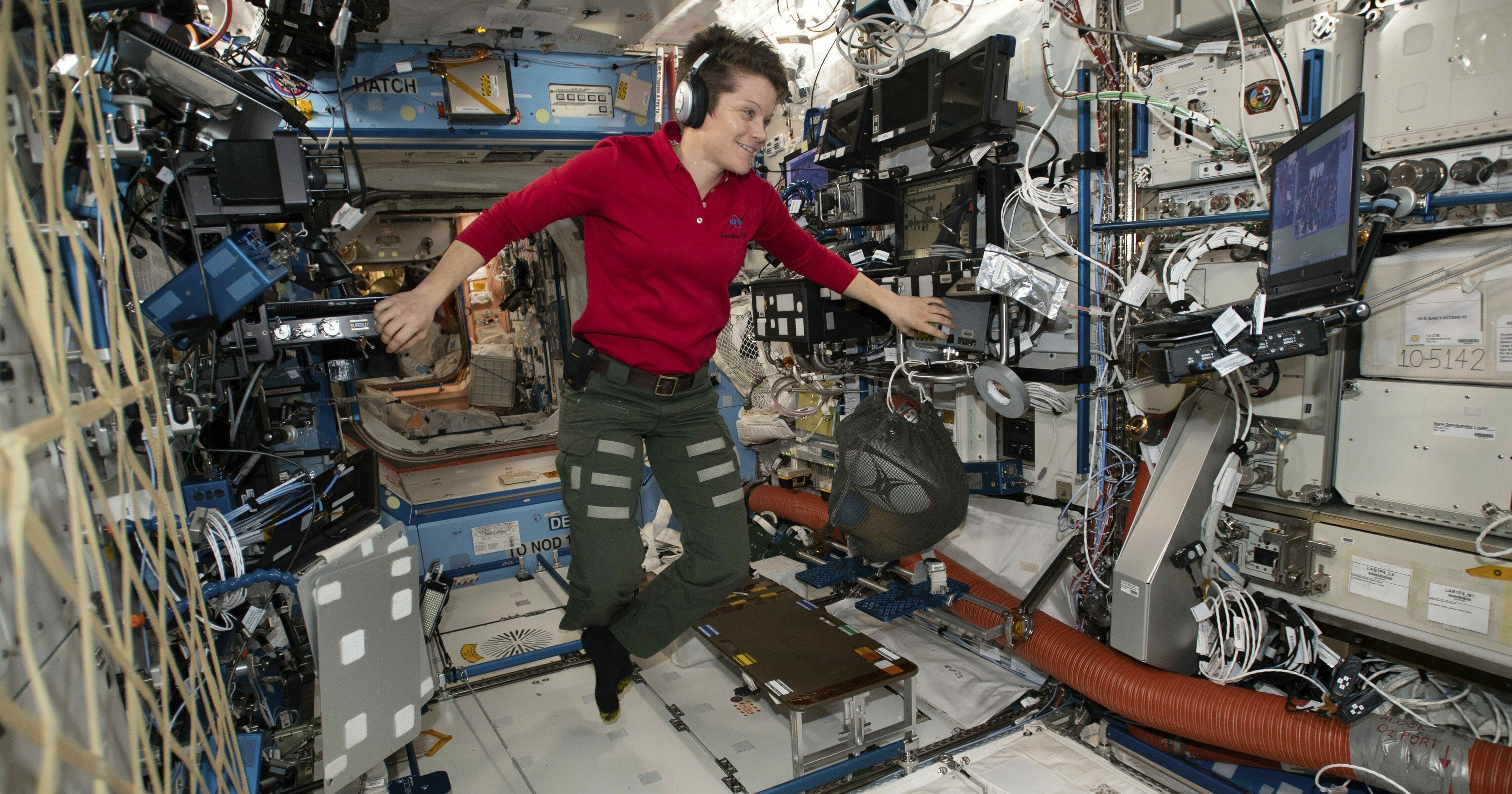 Flight Engineer Anne McClain looks at a laptop computer screen inside the U.S. Destiny laboratory module of the International Space Station on Jan. 18, 2019.