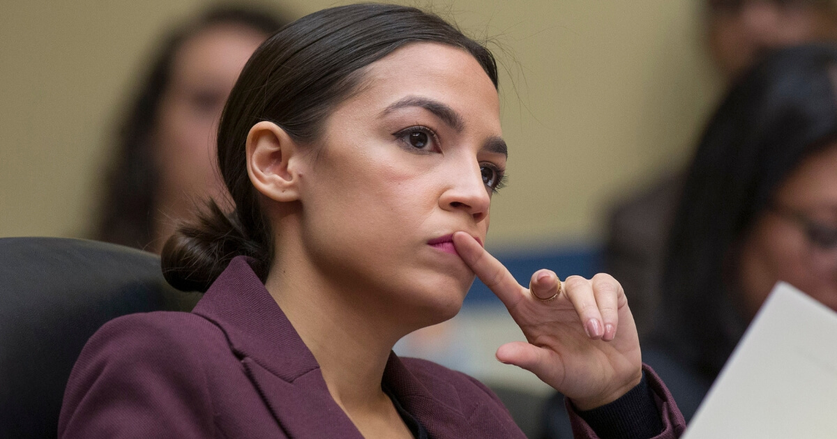 Rep. Alexandria Ocasio-Cortez listens to questions as Michael Cohen testifies on Capitol Hill, on Wednesday, Feb. 27, 2019, in Washington, D.C.