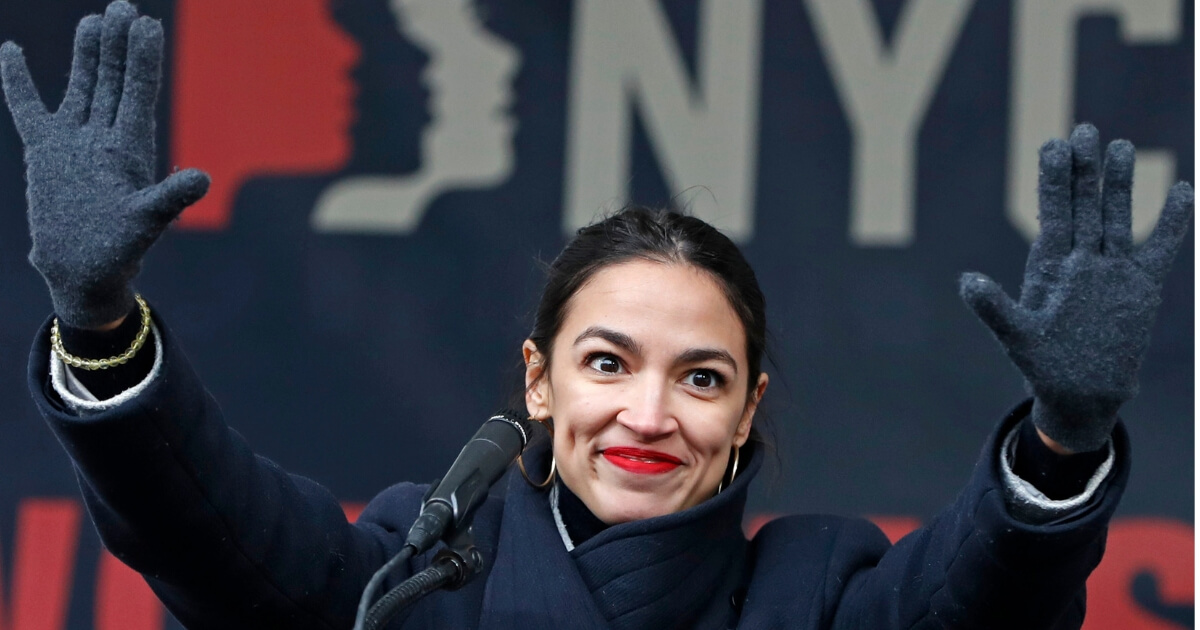 U.S. Rep. Alexandria Ocasio-Cortez, waves to the crowd in Lower Manhattan on Saturday, Jan. 19, 2019, in New York.