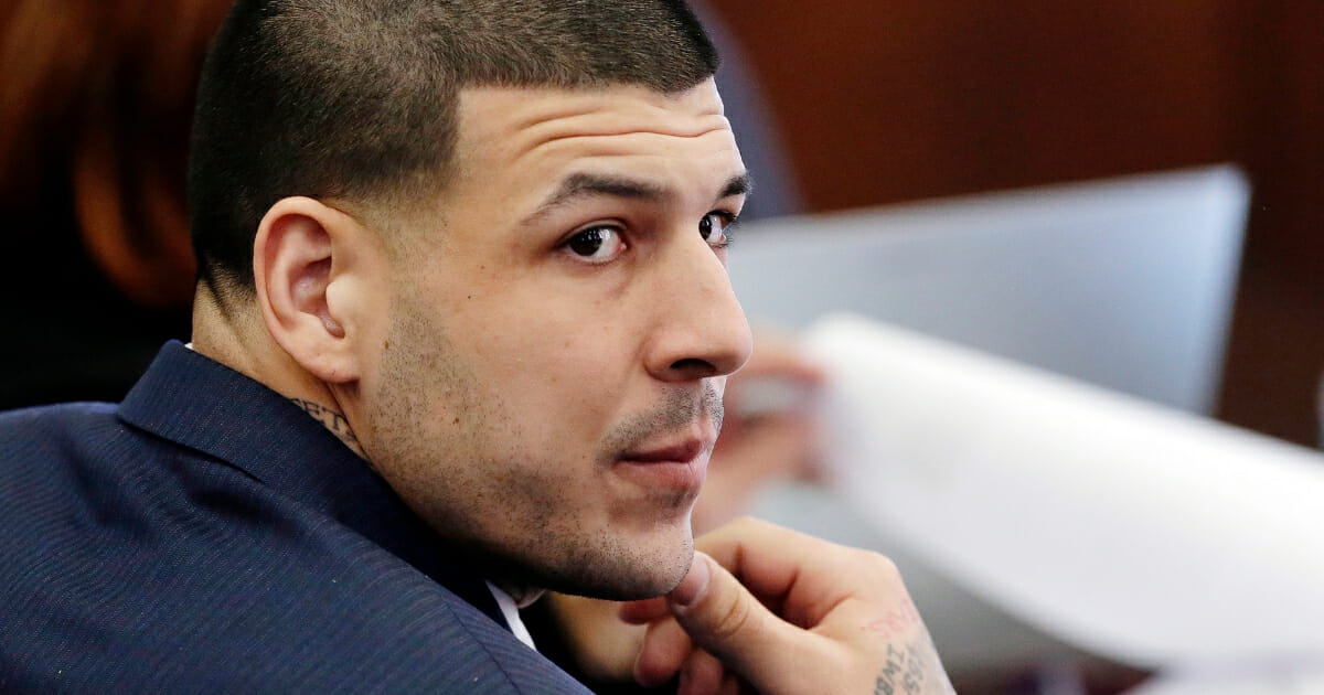 Aaron Hernandez listens to testimony March 15, 2017, during his double murder trial in Suffolk Superior Court in Boston.