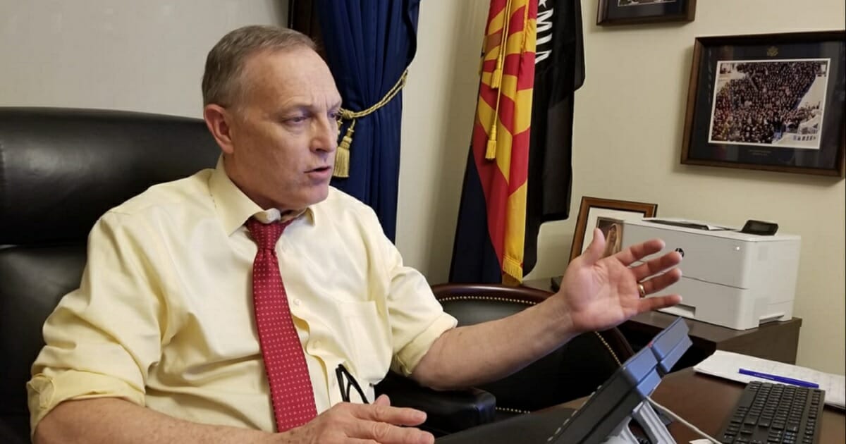 U.S. Rep. Andy Biggs, an Arizona Republican, takes part in a telephone town hall meeting with constituents in late January.