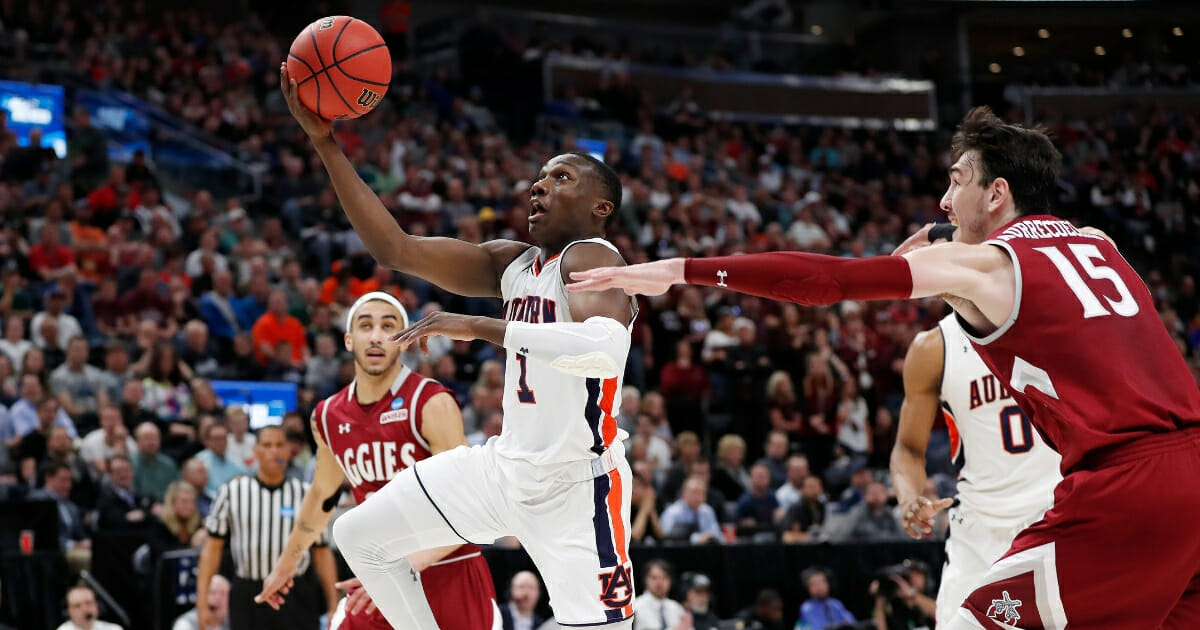 Auburn guard Jared Harper drives to the hoop against New Mexico State in a first-round NCAA Tournament game March 21, 2019, in Salt Lake City.