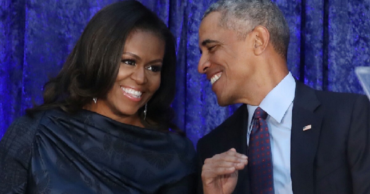 Former President Barack Obama and former first lady Michelle Obama in a February 2018 file photo.