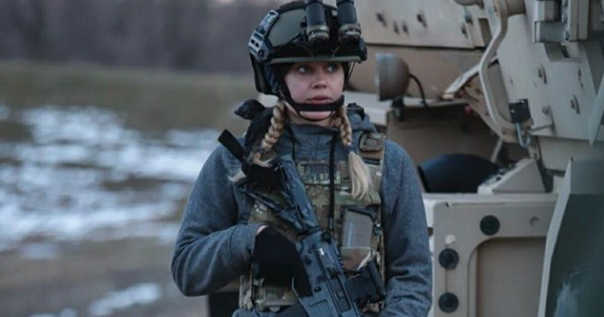 Actress Carly Schroeder in an Army uniform.