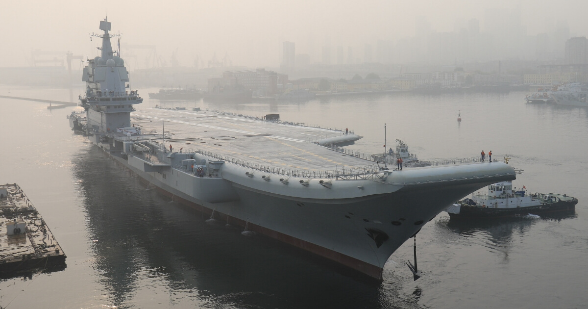 China's first domestically manufactured aircraft carrier, known only as Type 001A, leaves port in the city of Dalian early on May 13, 2018.