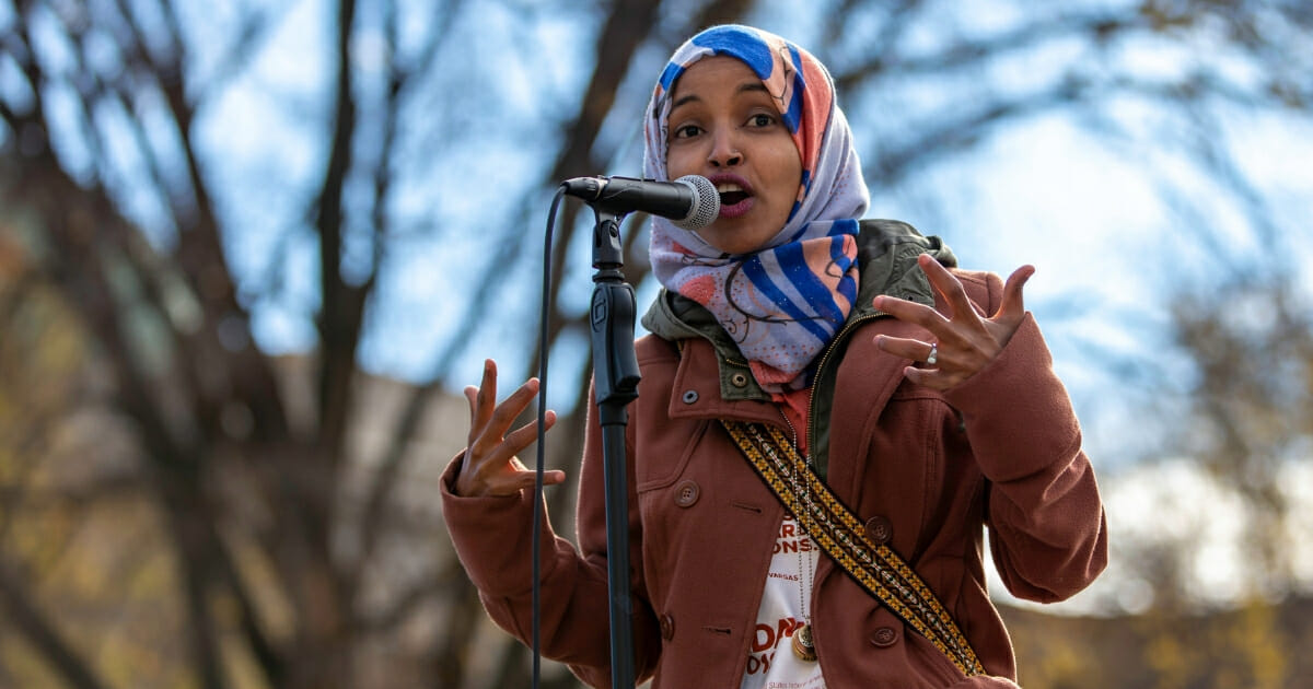 Democratic congressional candidate Ilhan Omar speaks to a group of supporters at University of Minnesota.