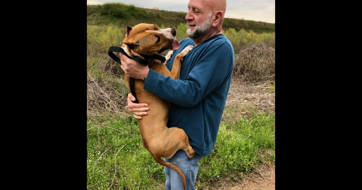 A man is reunited with his dog.