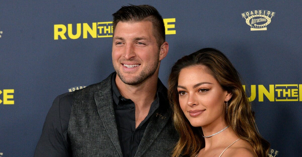 Tim Tebow and Demi-Leigh Nel-Peters attend the premiere of Roadside Attractions' 'Run The Race' at the Egyptian Theatre on Feb. 11, 2019, in Hollywood, California