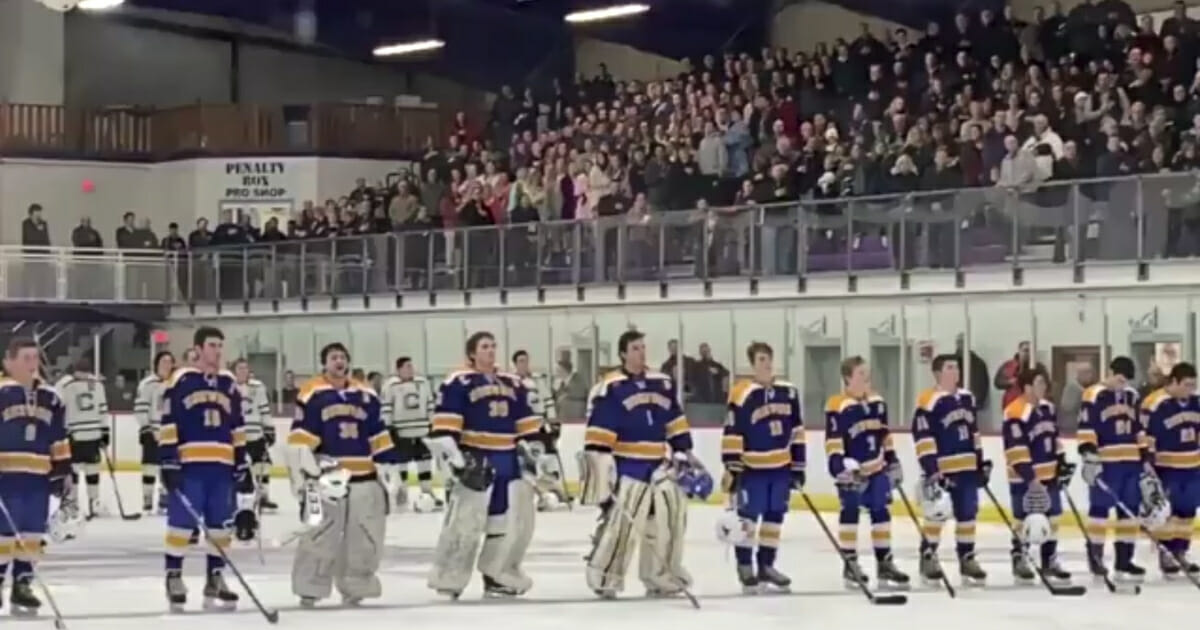 The crowd and hockey players from Massachusetts' Canton High and Norwood High finished the national anthem when the arena's audio system faltered.