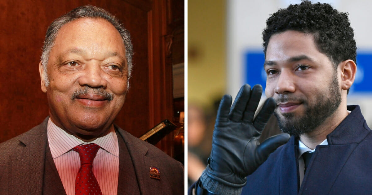 Actor Jussie Smollett, right, spent two days volunteering with the Rain PUSH Coalition, a nonprofit group started by the Rev. Jesse Jackson, left.
