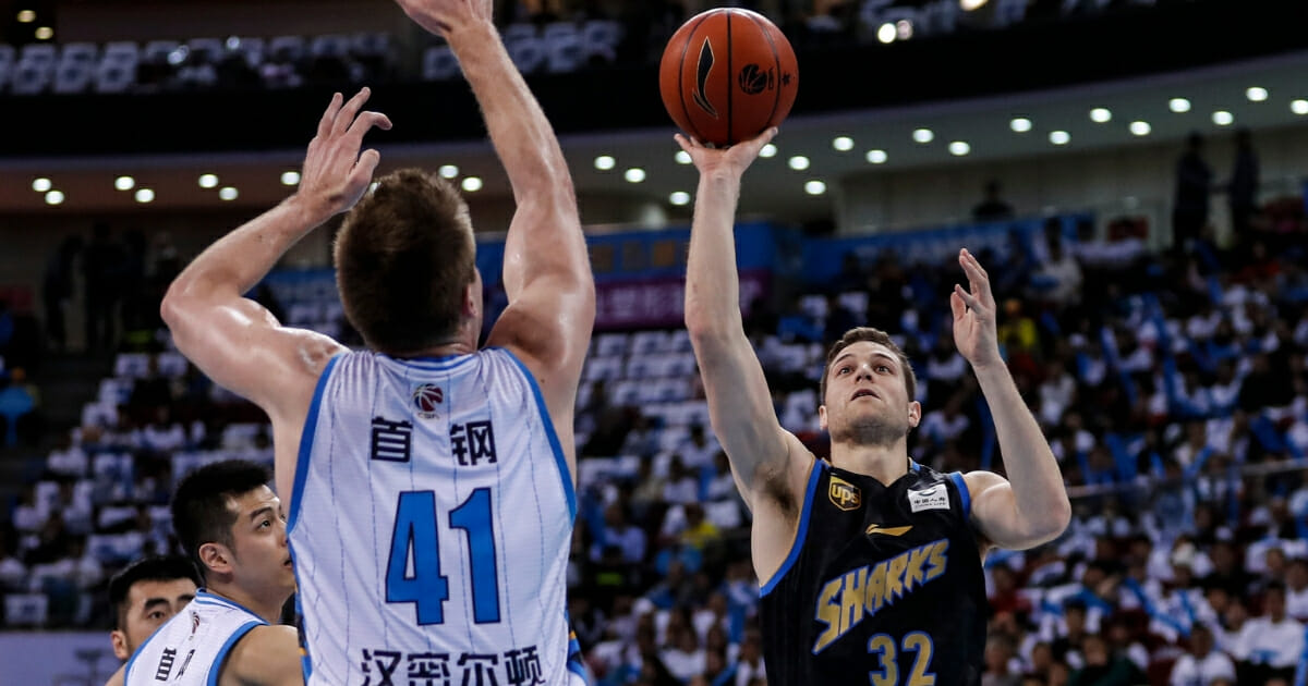 Jimmer Fredette takes a shot for the Shanghai Sharks in a Chinese Basketball Association game against the Beijing Ducks on March 16, 2019.