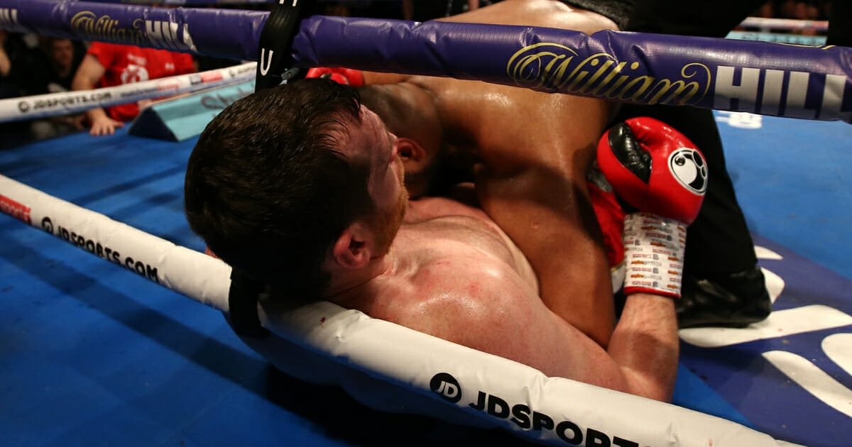 David Price reacts after being bitten by Kash Ali during their heavyweight bout at M&S Bank Arena on March 30, 2019 in Liverpool, England.