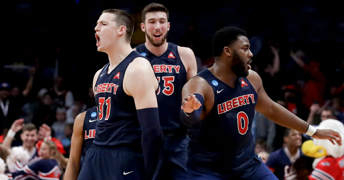 Liberty players celebrate their win against Mississippi State in the NCAA college basketball tournament Friday, March 22, 2019, in San Jose, Calif.