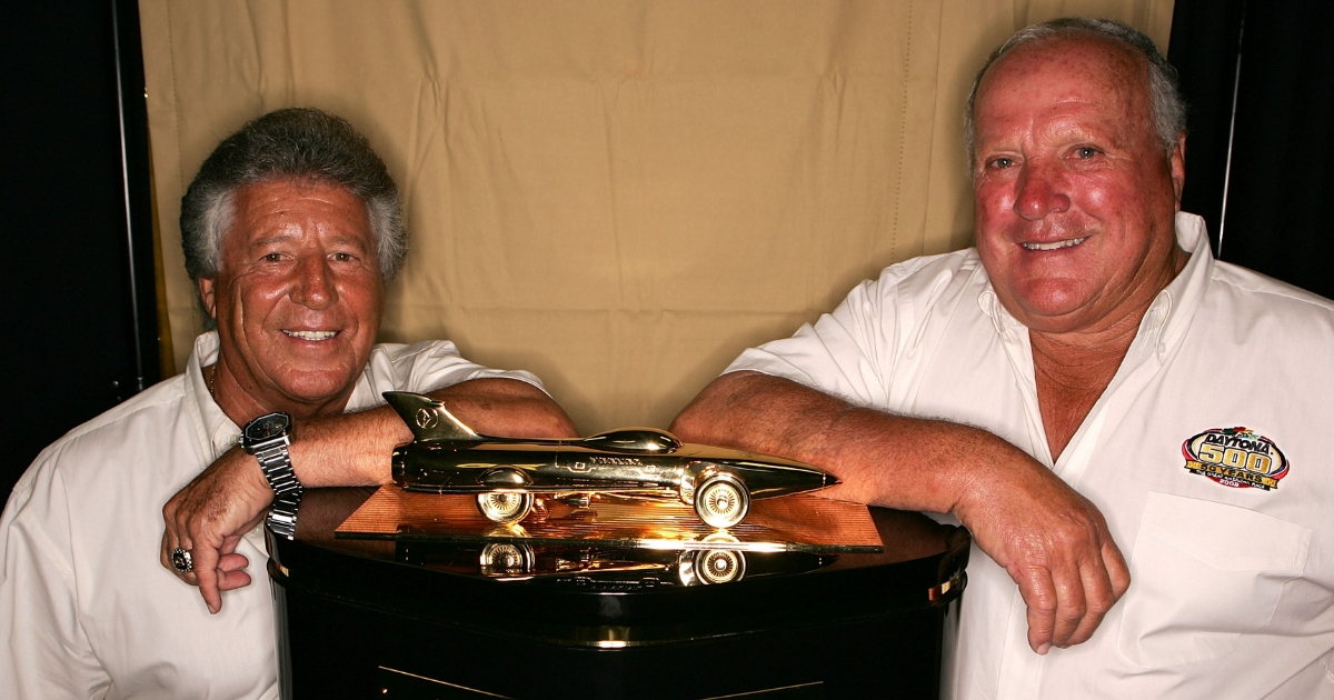 Daytona 500 winners, Mario Andretti (L) and A.J. Foyt, pose prior to practice for the NASCAR Nextel Cup Series Pepsi 400 at Daytona International Speedway on July 5, 2007 in Daytona, Florida.