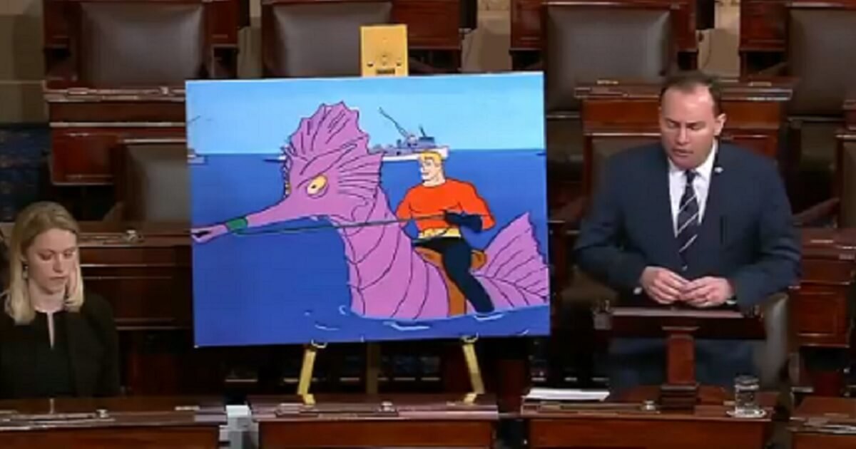 Utah Sen. Mike Lee uses the superhero Aquaman as a prop during a speech on the Senate floor on Tuesday.