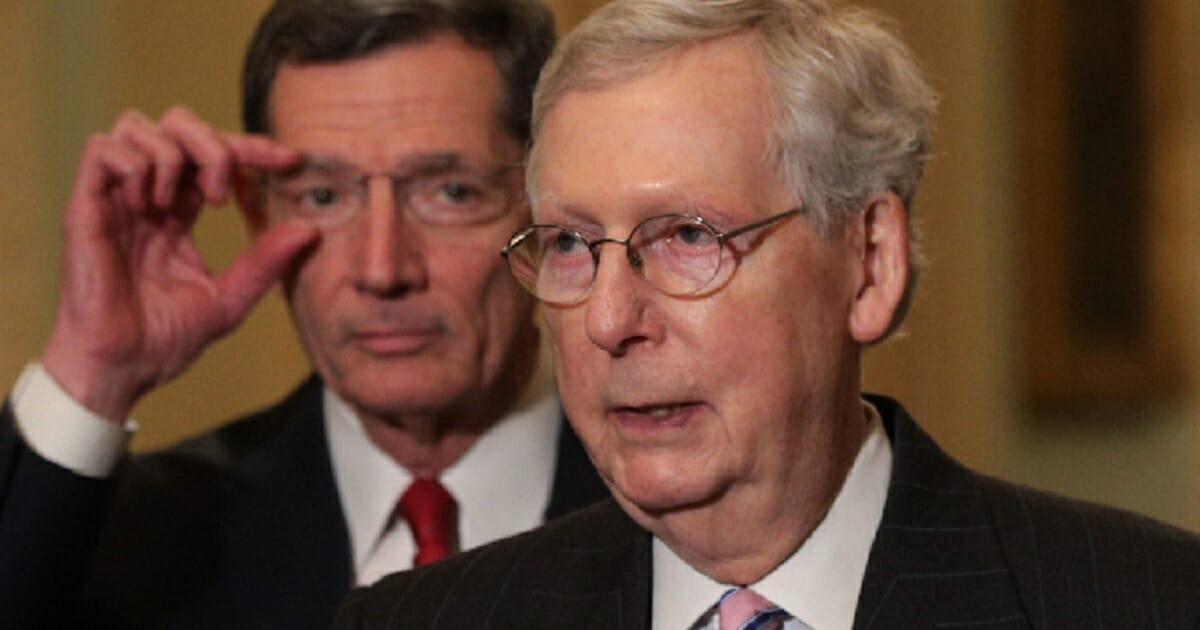 Senate Majority Leader Mitch McConnell addresses reporters during a March 12 news conference on Capitol Hill.