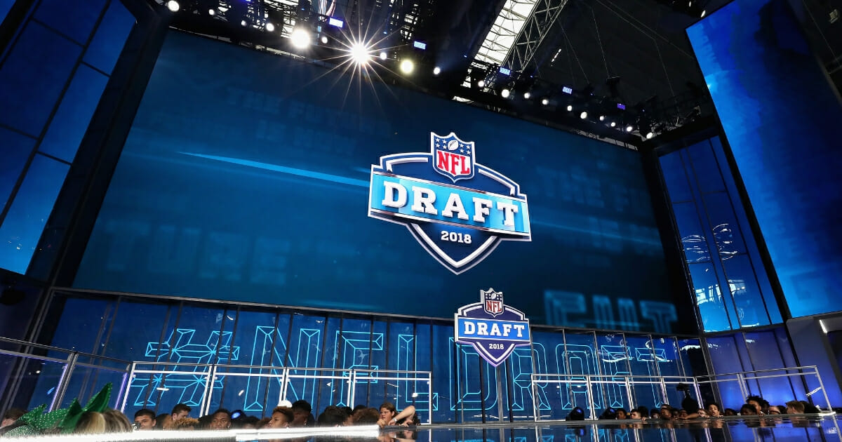 The 2018 NFL Draft logo is seen on a video board during the first round of the 2018 NFL Draft at AT&T Stadium on April 26, 2018 in Arlington, Texas.