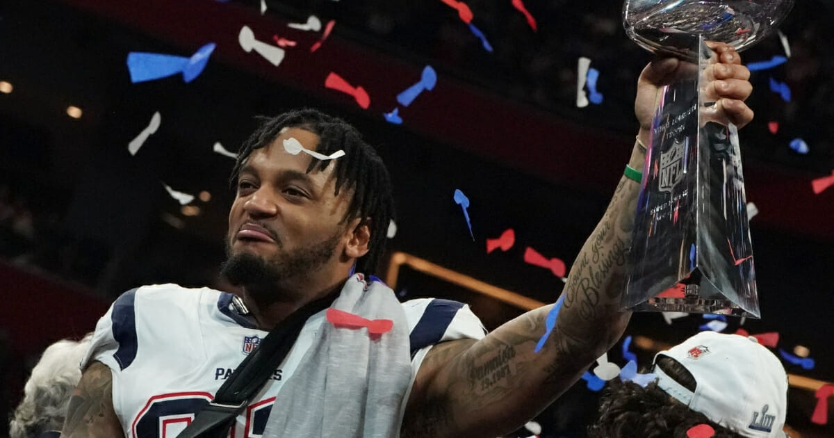 Patrick Chung holds the Lombardi Trophy after the New England Patriots beat the Los Angeles Rams in Super Bowl LIII at Mercedes-Benz Stadium in Atlanta on February 3, 2019.