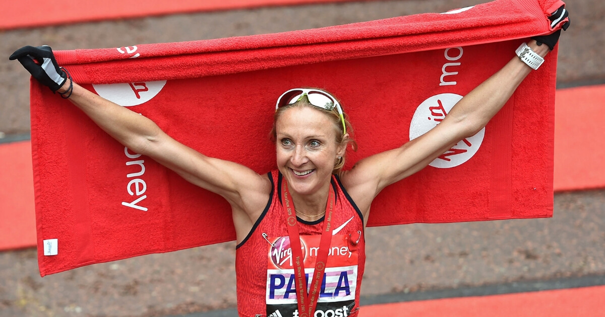 Paula Radcliffe of Great Britain poses for photos after competing in Virgin Money London Marathon on April 26, 2015 in London, England.