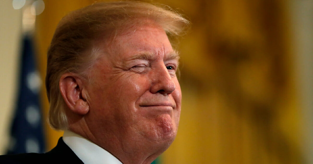 President Donald Trump winks Thursday, March 14, 2019, at the White House.