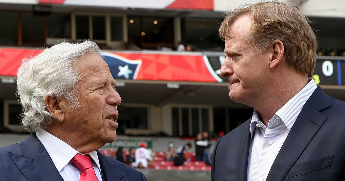 New England Patriots owner Robert Kraft, left, talks with NFL Commissioner Roger Goodell.