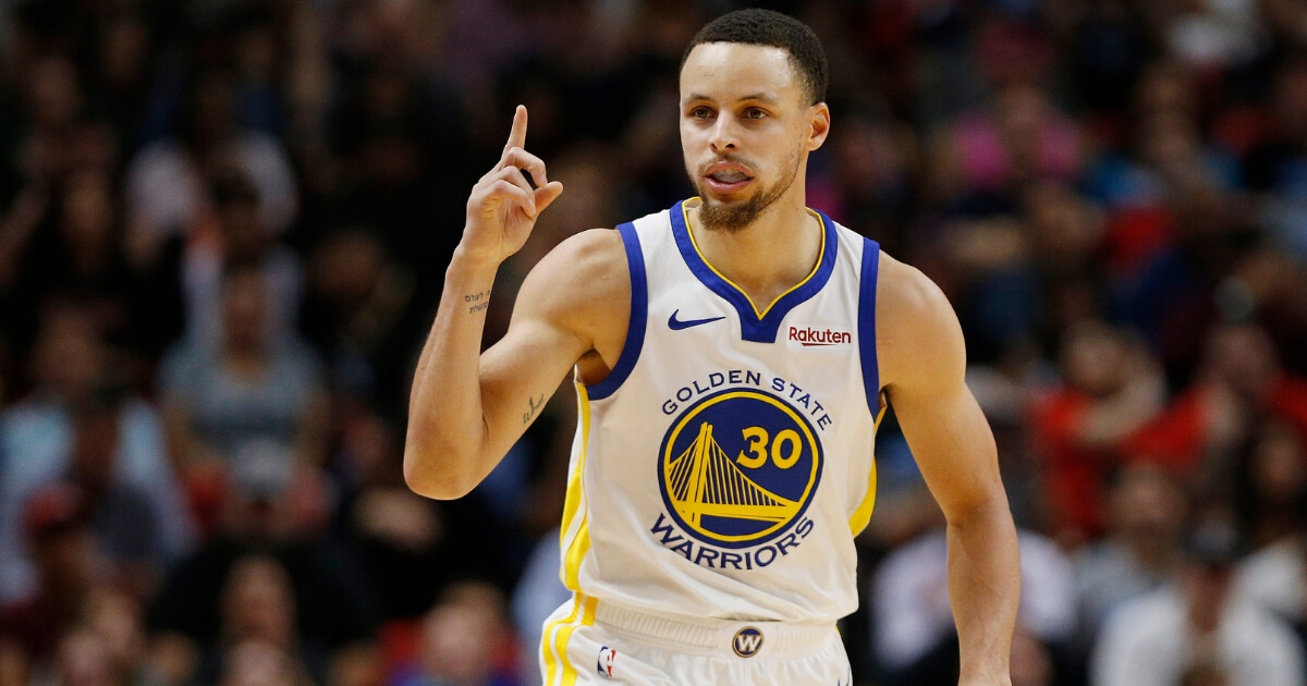 Stephen Curry #30 of the Golden State Warriors celebrates against the Miami Heat during the second half at American Airlines Arena on Feb. 27, 2019 in Miami, Florida.