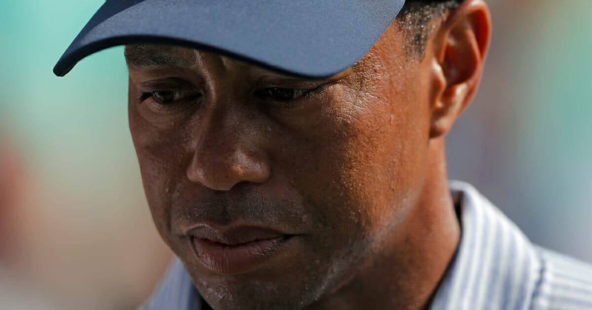 Tiger Woods looks down after a quadruple bogey on the 17th hole during the second round of The Players Championship on March 15, 2019.